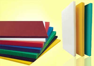 Industrial HDPE, UHMWPE, and PE500 sheets stacked in a warehouse ready for manufacturing use
